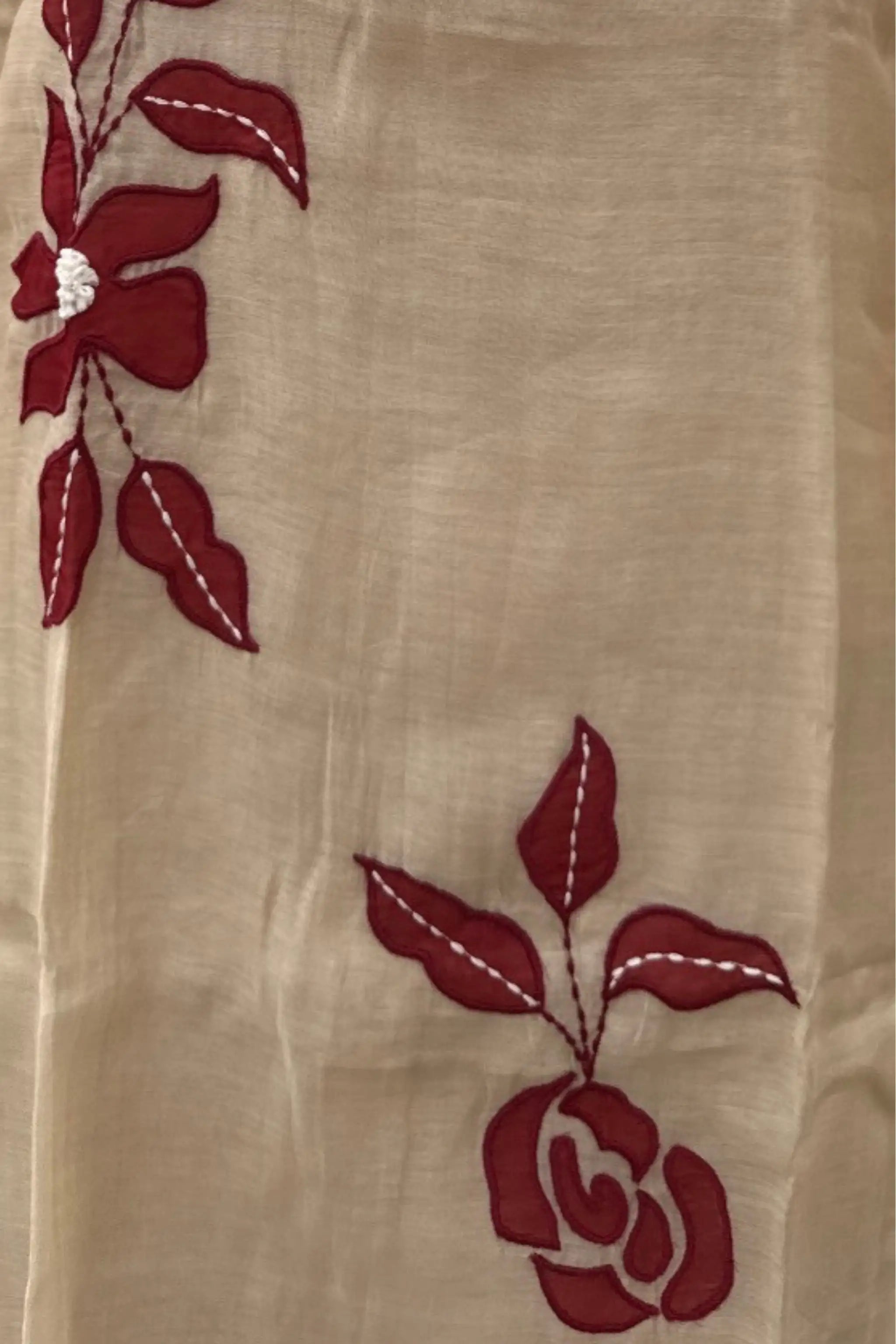 Beige fabric with red floral embroidery